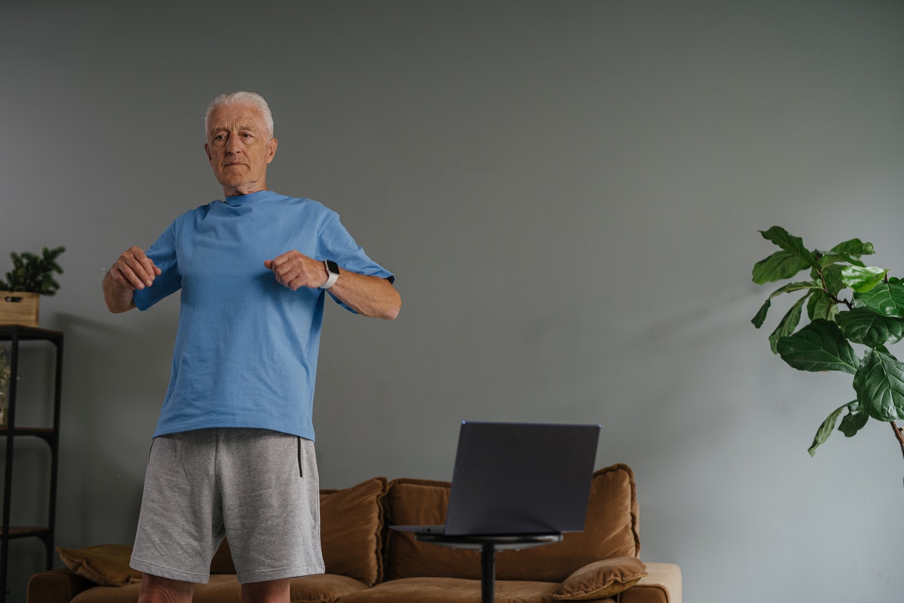 Man exercises his core muscles in his lounge